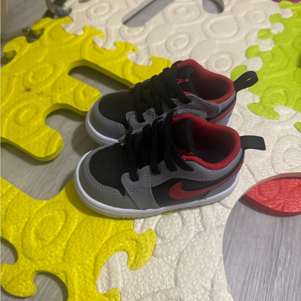 Nike Kids Black and Gray Sneakers with Red Accents